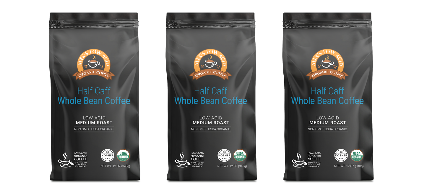 Three black bags of Alex's Low-Acid Organic Coffee™ - Half Caff Whole Bean, 12oz each, by Alex's Low Acid Coffee, with brown and blue branding on a white background. Enjoy smooth, low acid coffee in every cup.