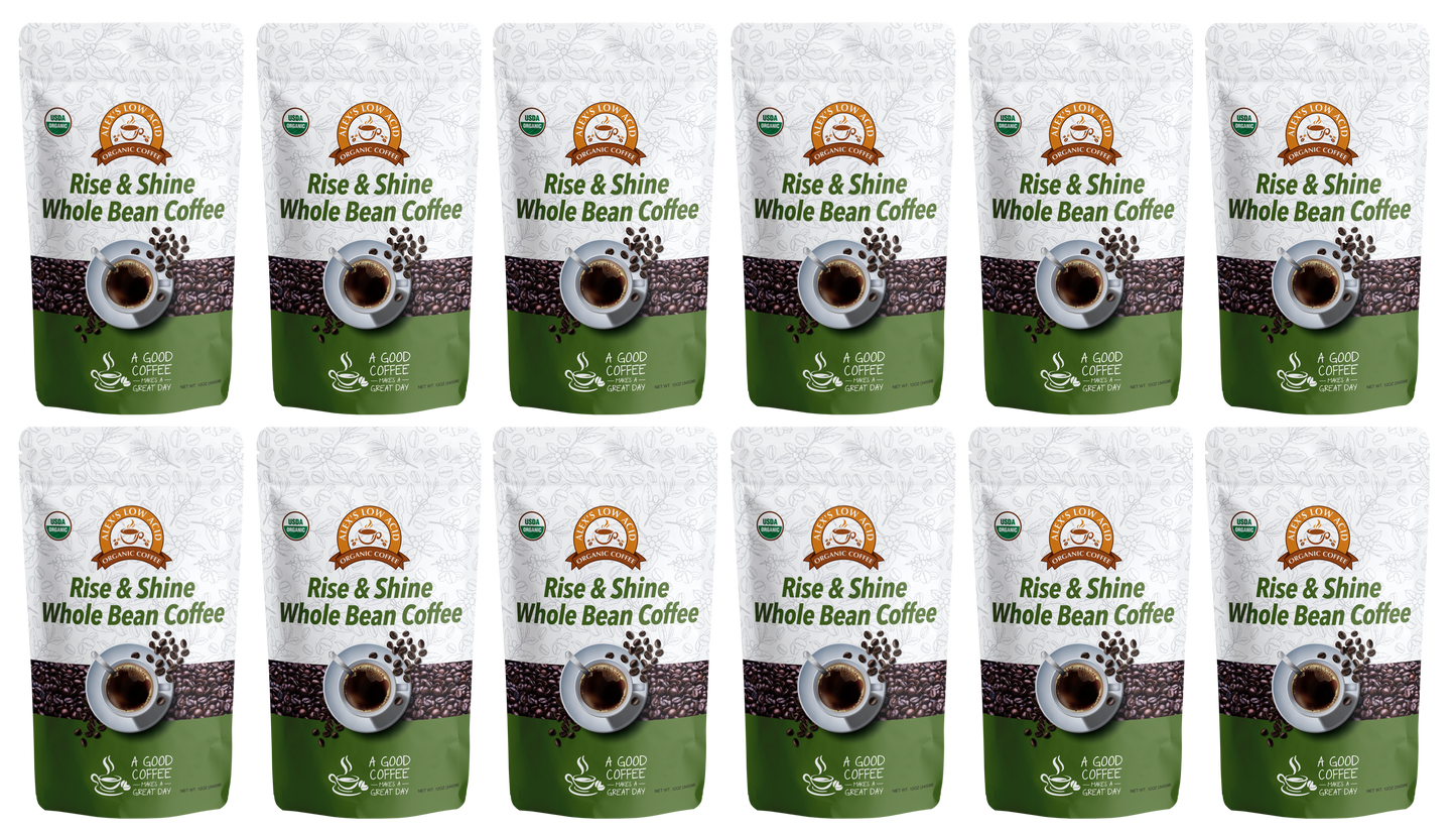 Twelve bags of Alex's Low-Acid Organic Coffee™ - Rise and Shine Whole Bean (12oz) by Alex's Low Acid Coffee are arranged in three rows, with green and white packaging highlighting organic certification and its gentle, low-acid blend.