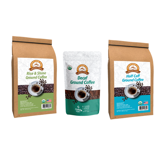 Alex's Low Acid Coffee All Day Drinker Fresh Ground Variety Pack includes Rise & Shine, Decaf, and Half Caff blends—each in branded packaging with a coffee cup design—offering delicious low-acid organic coffee.