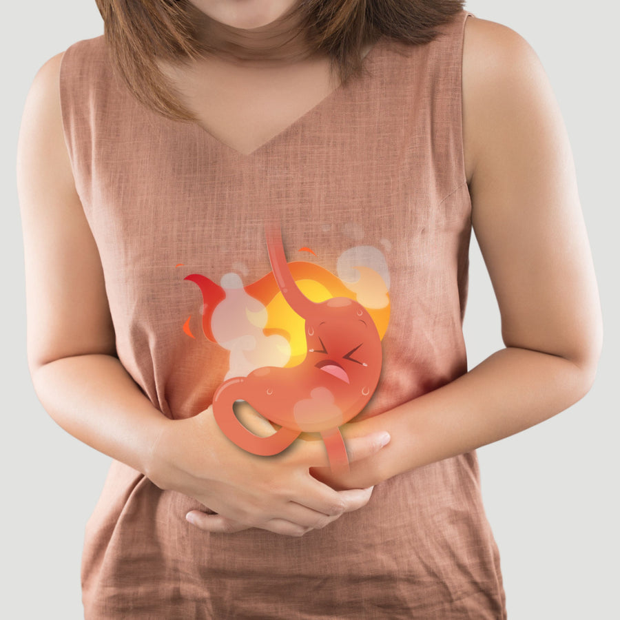 A person in a light brown sleeveless top holds their stomach, showing a cartoonish, distressed stomach graphic surrounded by steam and flames, indicating discomfort or pain.