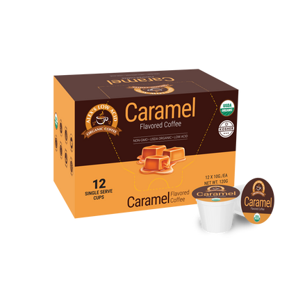 A box of Alex's Low Acid Organic Coffee™ Single Serve Flavored Cups - Caramel by Alex's Low Acid Coffee shows caramel imagery and certifications. The box contains 12 low acid pods, with one pod and its lid displayed in front.