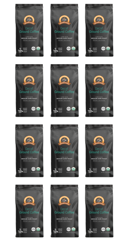 Twelve Alex's Low-Acid Organic Coffee™ Decaf Fresh Ground (12oz) bags are arranged in a 4x3 grid. Each black bag features a circular orange logo plus organic and fair trade badges—ideal for heartburn relief. Brand: Alex's Low Acid Coffee.