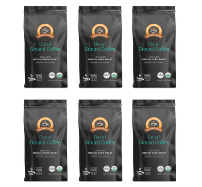Six bags of Alex's Low Acid Coffee—Alex's Low-Acid Organic Coffee™ Decaf Fresh Ground (12oz), Medium Dark Roast, labeled "Low Acid" with orange and teal accents—arranged in two rows of three for gentle, heartburn-friendly coffee enjoyment.