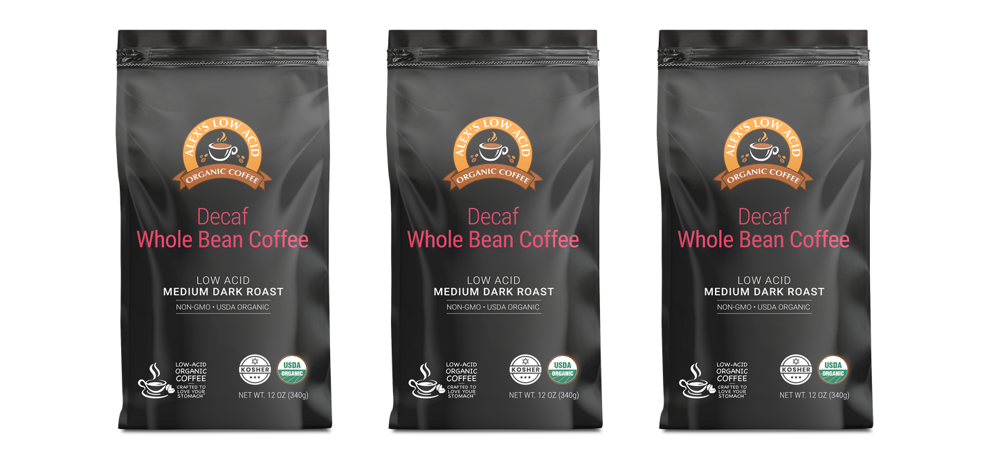 Three bags of Alex's Low-Acid Organic Coffee™ Decaf Whole Bean (12oz) by Alex's Low Acid Coffee, labeled low acid for heartburn relief, medium dark roast, non-GMO, and USDA organic, are displayed upright against a light background.