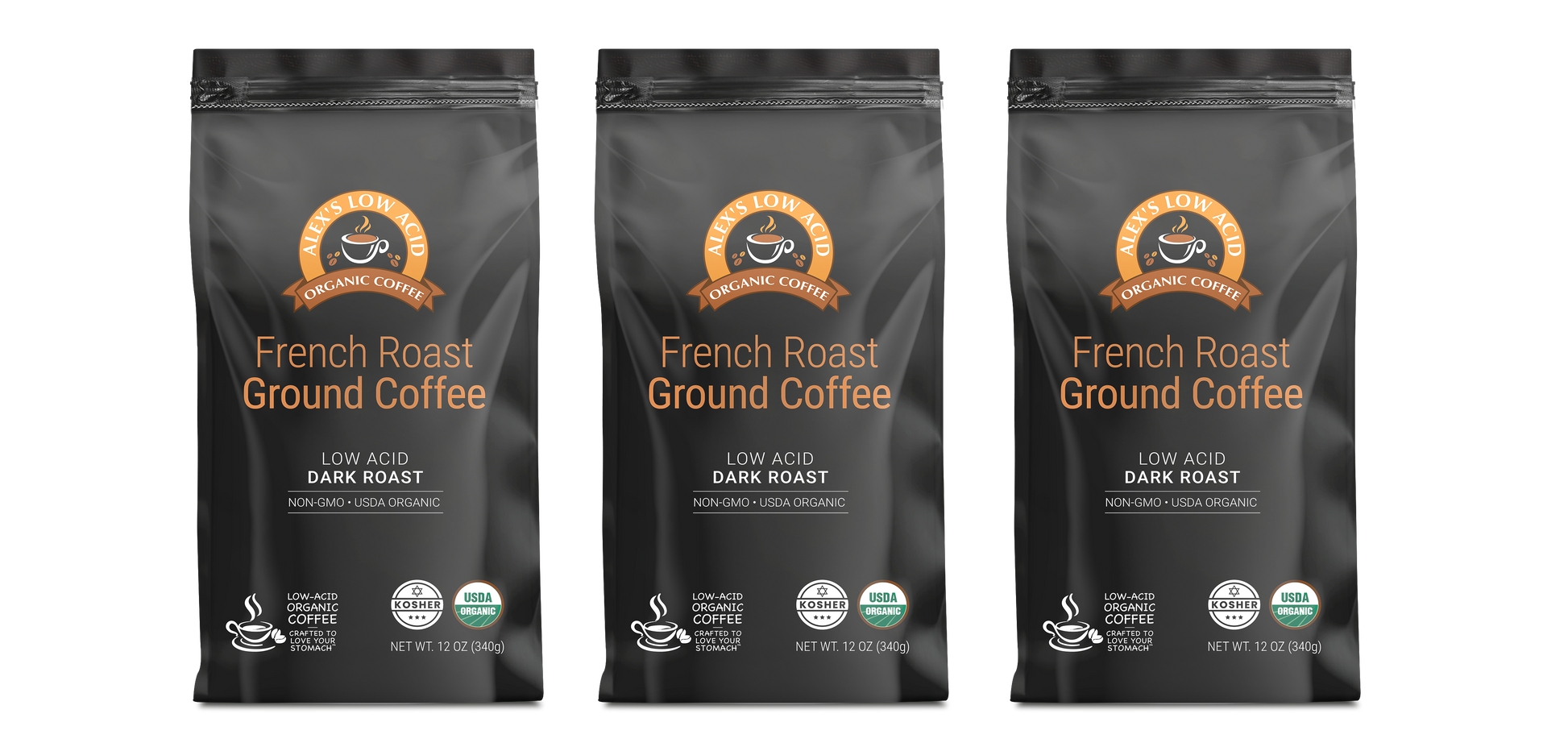 Three black bags of Alex's Low-Acid Organic Coffee™ - French Roast (12oz) from Alex's Low Acid Coffee are lined up, each with an orange and white label stating "Low Acid, Dark Roast, Non-GMO, USDA Organic"—ideal for low acid coffee enthusiasts.