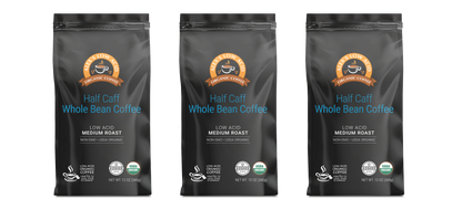 Three black bags of Alex's Low-Acid Organic Coffee™ - Half Caff Whole Bean, 12oz each, by Alex's Low Acid Coffee, with brown and blue branding on a white background. Enjoy smooth, low acid coffee in every cup.