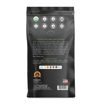 Back of Alex's Low-Acid Organic Coffee™ - Rise and Shine Whole Bean (12oz) bag features organic logos, a founder's note, caramel and dulce de leche cupping notes, contact info, and a U.S. flag showing it's made in the USA.