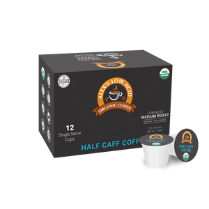 A box labeled Alex's Low-Acid Organic Coffee™ Single Serve Cups - Half Caff from Alex's Low Acid Coffee, containing 12 medium roast pods. The black box with orange and blue accents is shown with a single coffee pod beside it.