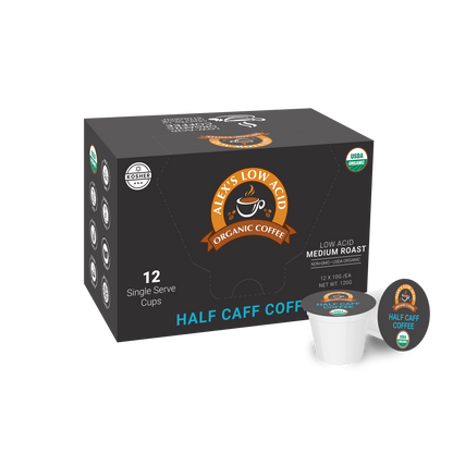 A box labeled Alex's Low-Acid Organic Coffee™ Single Serve Cups - Half Caff from Alex's Low Acid Coffee, containing 12 medium roast pods. The black box with orange and blue accents is shown with a single coffee pod beside it.