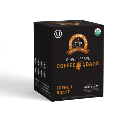 A black box of Alex's Low-Acid Organic Coffee™ French Roast Coffee Steep Bags features gold and white text, USDA Organic and Kosher symbols, and contains 10 single-serve tea bag style bags for a rich, low-acid brew.