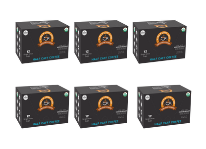 Six boxes of Alex's Low-Acid Organic Coffee™ Single Serve Cups - Half Caff (12 cups per box) from Alex's Low Acid Coffee are arranged in two rows of three. The black packaging features orange and blue accents against a white background.