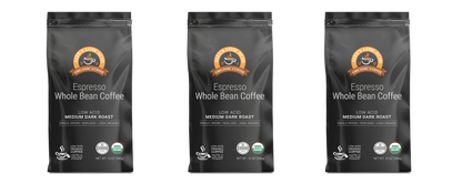 Three black bags of Alex's Low Acid Organic Coffee™ - Espresso Whole Bean (12oz) by Alex's Low Acid Coffee, USDA Organic certified, each featuring a brown lion logo at the top. The background is plain white.
