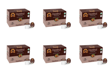 Six boxes of Alex's Low Acid Organic Coffee™ Single Serve Flavored Cups - Hazelnut by Alex's Low-Acid Organic Coffee are arranged in two rows on a white background, each with two heartburn-friendly, low-acid coffee pods placed in front.