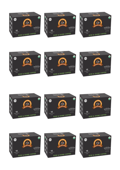 Twelve boxes of Alex's Low-Acid Organic Coffee™ Single Serve Cups - Rise & Shine by Alex's Low Acid Coffee are arranged in a grid. Each black box with orange and white graphics contains 12 low-acid, organic single-serve cups.