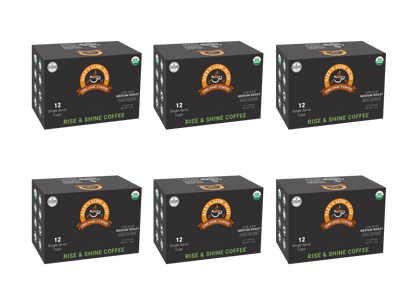 Six boxes of Alex's Low-Acid Organic Coffee™ Single Serve Cups - Rise & Shine by Alex's Low Acid Coffee are arranged in two rows of three. Each black box holds 12 cups and features an orange and white logo with a coffee cup illustration.